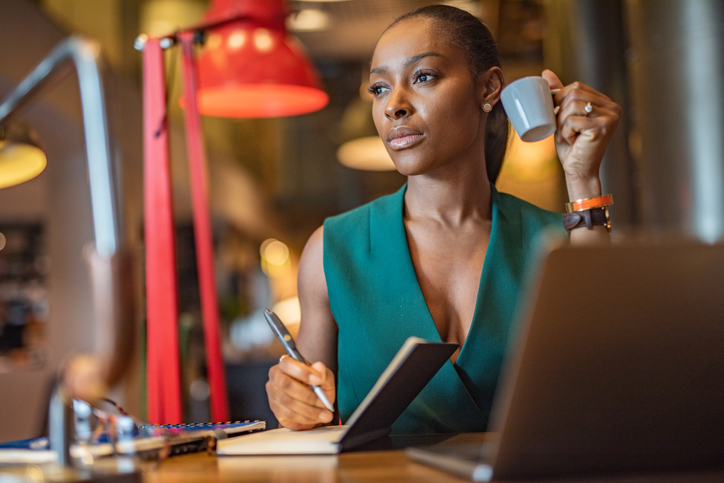 Woman, writing something in journal. 